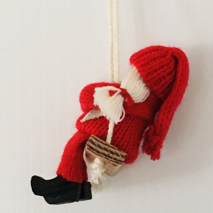 Swedish tomte on swing  ornament