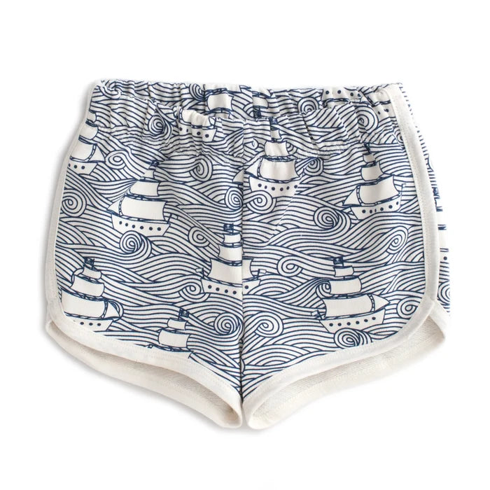 Shorts with navy ship and wave pattern on a white background