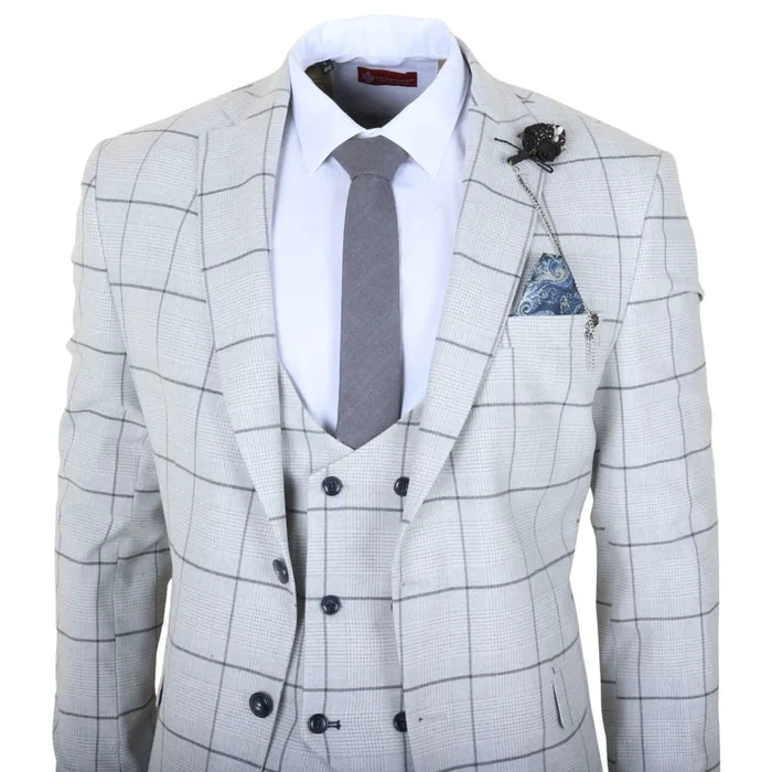 Front view of a men's tailored fit grey plaid check suit with a white dress shirt, grey tie, and pocket square, at a racecourse.