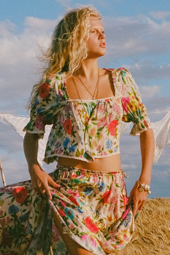Front view of a model wearing the Valley of the Dolls Blouse, showing contrast lace trim and puff sleeves