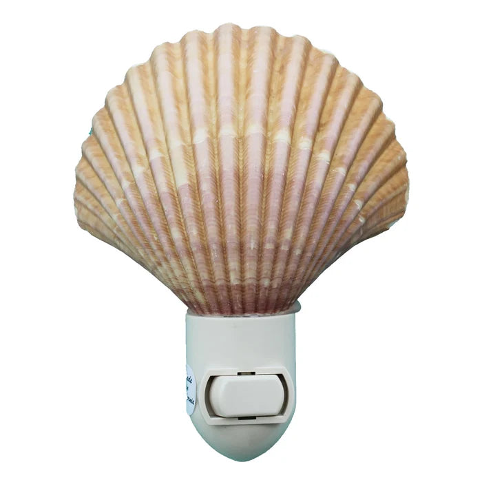 Yellow Cup Seashell Night Light — a large fan-shaped scallop shell with warm tan and blush ribbed ridges mounted on a white plastic plug-in switch base with a toggle switch, on a white background